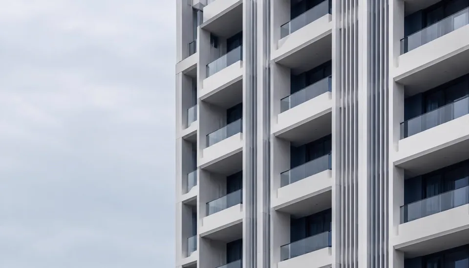 Architectural detail: balcony slabs and vertical fins on a residential facade
